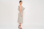 Woman wearing a polka dot dress on a white background